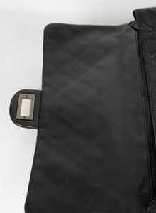Chanel Roll Up Maxi Clutch in pelle matelassé nera