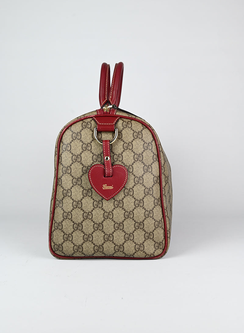 Gucci Bauletto Monogram con profili rossi